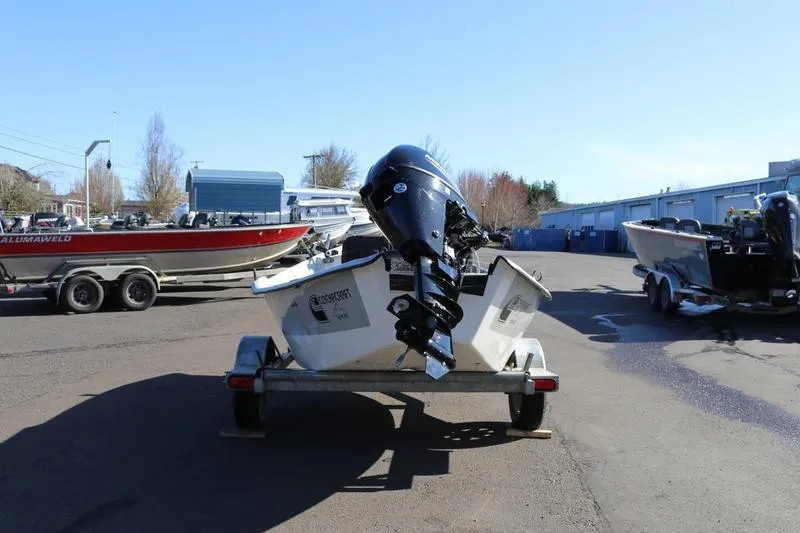 Slide: The Image of 2005 ClackaCraft 16 Drift Boat on trailer, parked outdoors. - 2