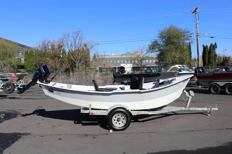 Slide: The Image of 2005 ClackaCraft 16 Drift Boat on trailer, parked outdoors. - 3