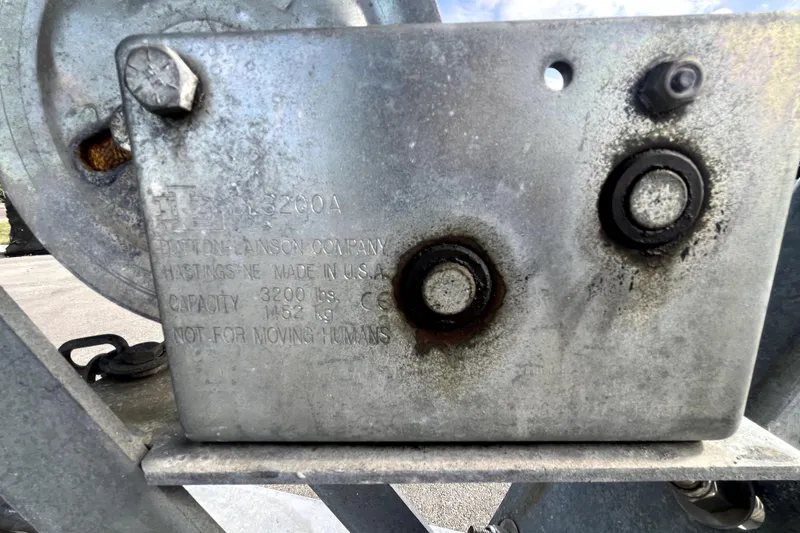 Slide: The Image of Close-up of a metal winch plate with capacity details, Sea Ray Sundancer 260, 2007. - 19