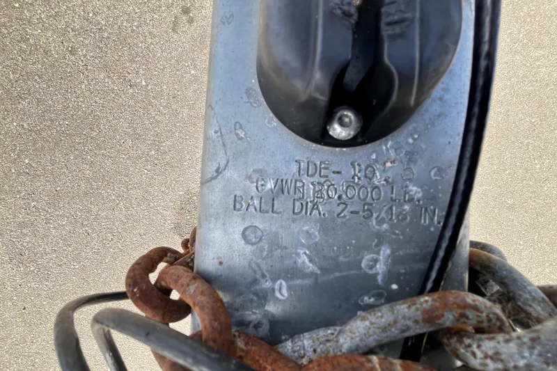 Slide: The Image of Trailer hitch with rusted chains, marked "TDE-1015" and "13,000 LB" capacity. - 20
