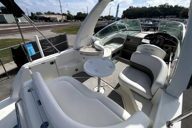Slide: The Image of 2007 Sea Ray Sundancer 260 boat interior with seating and steering wheel. - 24