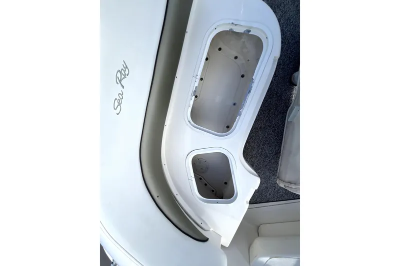 Slide: The Image of 2007 Sea Ray Sundancer 260 boat interior with storage compartments and logo detail. - 27