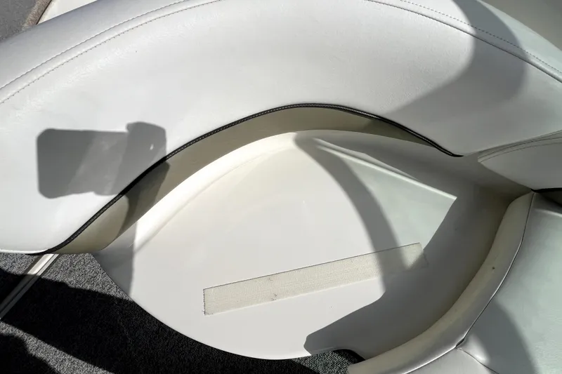 Slide: The Image of White leather seating on a 2007 Sea Ray Sundancer 260 boat, with shadow and stitching detail. - 36