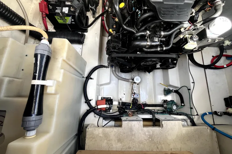 Slide: The Image of Engine compartment of a 2007 Sea Ray Sundancer 260 boat, showcasing mechanical components. - 64