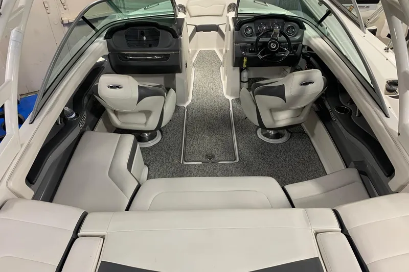 Slide: The Image of Interior of a 2014 Chaparral 206 SSi boat with plush seating and modern dashboard. - 3
