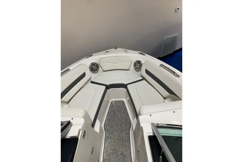 Slide: The Image of 2014 Chaparral 206 SSi boat interior with white seating and speakers. - 5