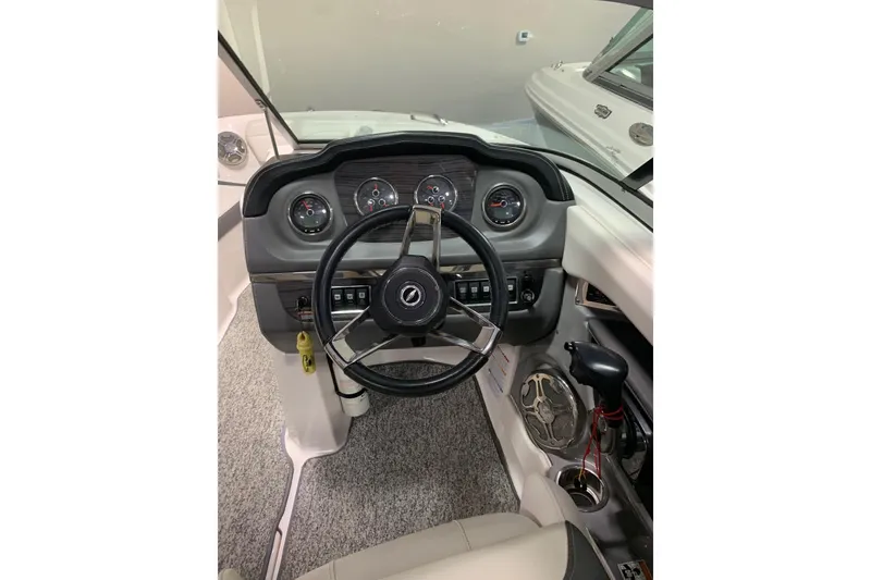 Slide: The Image of 2014 Chaparral 206 SSi boat dashboard with steering wheel and instrument panel. - 6