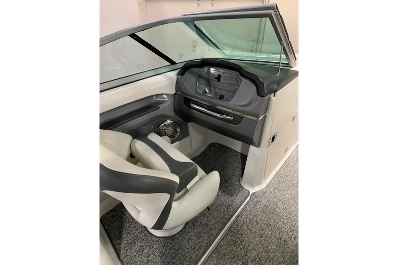 Slide: The Image of Interior of 2014 Chaparral 206 SSi boat with sleek seating and dashboard. - 7