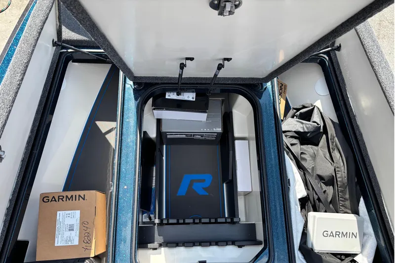 Slide: The Image of Ranger Z519R 2025 storage compartment with Garmin equipment. - 7