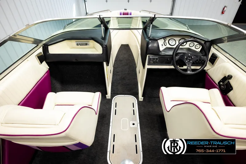 Slide: The Image of Interior of a 1993 American Skier Eagle boat with white and purple seating. - 13