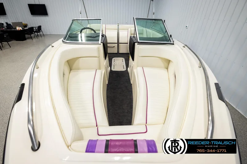 Slide: The Image of Interior of a 1993 American Skier Eagle boat with white seating and purple accents. - 15
