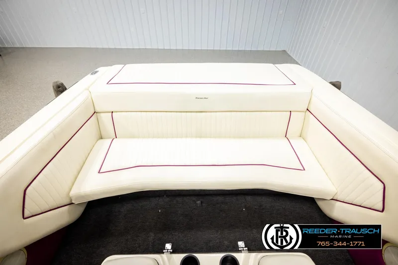 Slide: The Image of Interior of a 1993 American Skier Eagle boat with cream upholstery and red accents. - 17