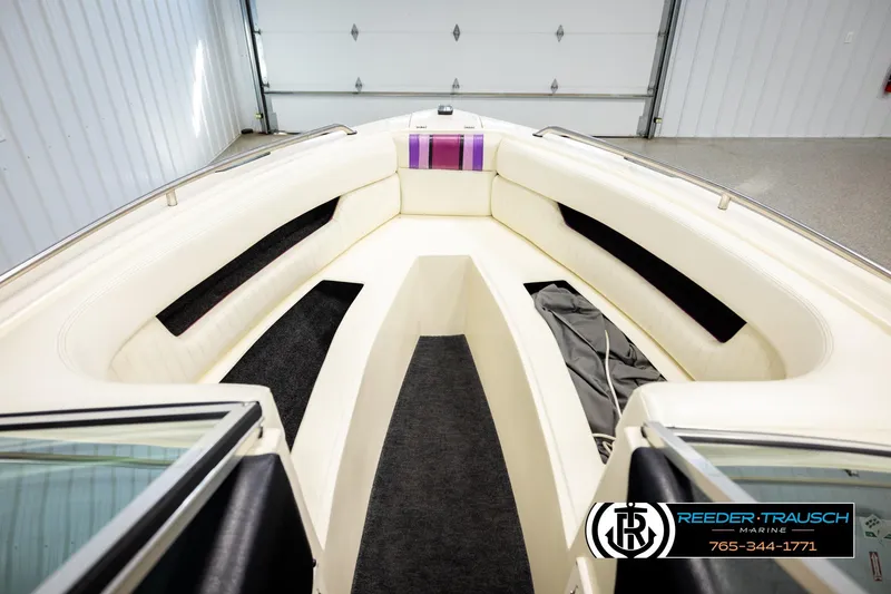 Slide: The Image of Interior of a 1993 American Skier Eagle boat with white seating and black carpet. - 19