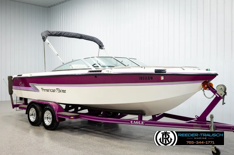 Slide: The Image of 1993 American Skier Eagle boat on trailer in indoor showroom. - 2