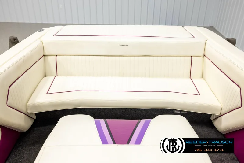 Slide: The Image of 1993 American Skier Eagle boat interior with white and purple seating. - 20