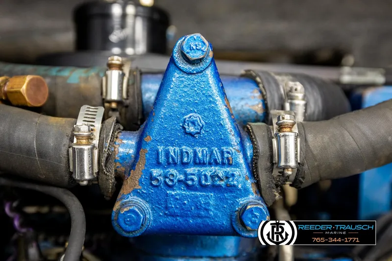 Slide: The Image of Close-up of a 1993 American Skier Eagle engine component with visible hoses and clamps. - 25