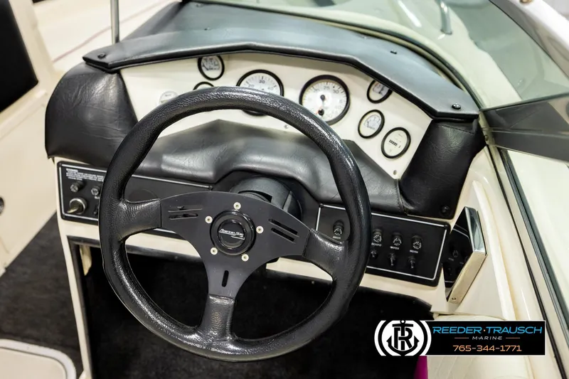 Slide: The Image of 1993 American Skier Eagle boat dashboard with steering wheel and instrument panel. - 27