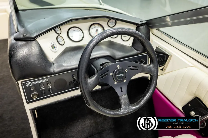 Slide: The Image of 1993 American Skier Eagle boat dashboard with steering wheel and instrument panel. - 28