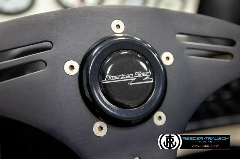 Slide: The Image of Steering wheel of a 1993 American Skier Eagle boat, featuring logo and branding. - 29