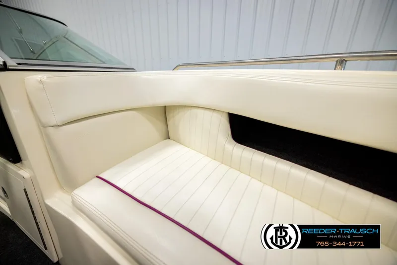 Slide: The Image of White interior seating of a 1993 American Skier Eagle boat, featuring sleek design and stitching. - 39