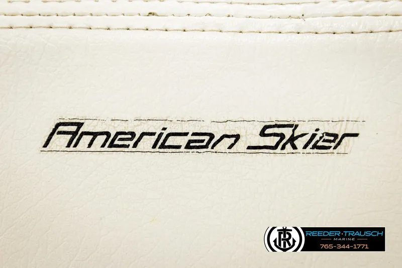 Slide: The Image of American Skier Eagle 1993 logo on white leather background, Reeder-Trausch Marine branding. - 40
