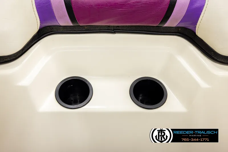 Slide: The Image of 1993 American Skier Eagle boat interior with purple seat and dual cup holders. - 42