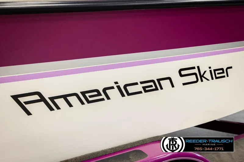 Slide: The Image of 1993 American Skier Eagle boat with purple and white design, Reeder-Trausch Marine logo. - 47