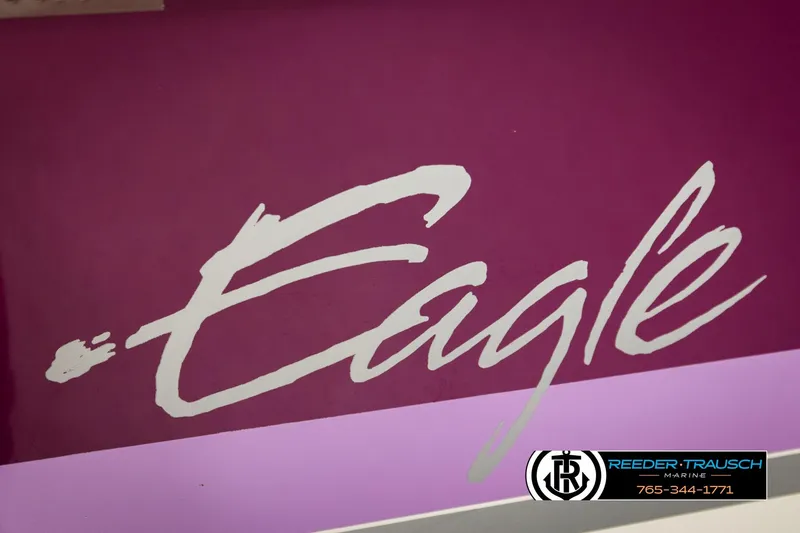 Slide: The Image of 1993 American Skier Eagle logo on purple background, Reeder-Trausch Marine branding visible. - 48