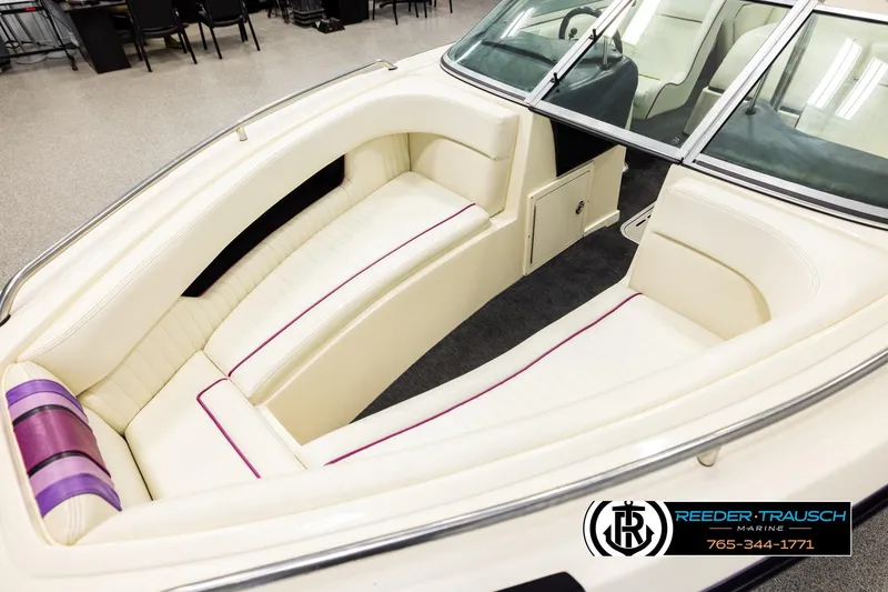 Slide: The Image of Interior of a 1993 American Skier Eagle boat with white and purple seating. - 9