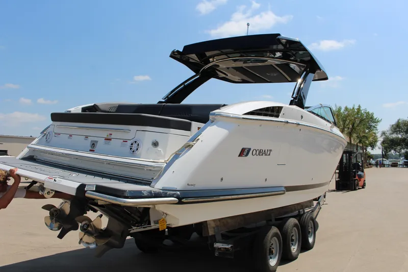 Slide: The Image of 2025 Cobalt R33 Surf boat on trailer, showcasing sleek design and modern features. - 15