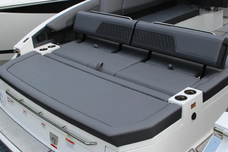 Slide: The Image of 2025 Cobalt R33 Surf boat with luxurious gray seating and cup holders. - 9