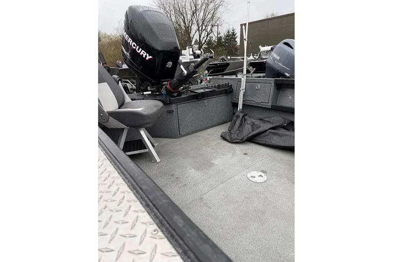 Slide: The Image of 2012 Alumaweld Super Vee Pro 23 boat interior with Mercury outboard motor. - 10