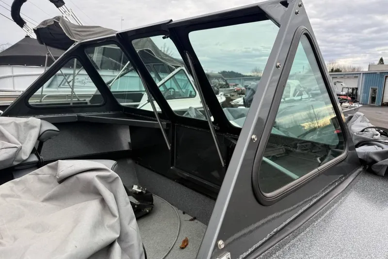 Slide: The Image of 2012 Alumaweld Super Vee Pro 23 boat with covered interior and windshield. - 5