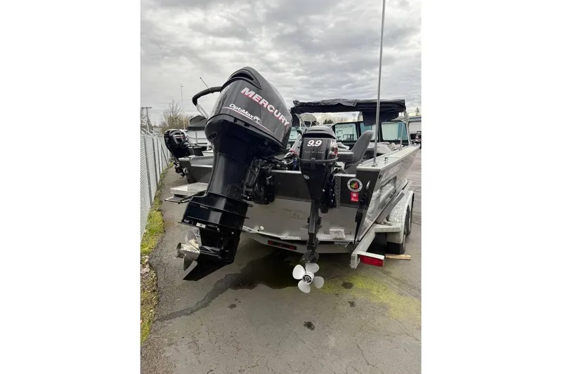 Slide: The Image of 2012 Alumaweld Super Vee Pro 23 boat with dual Mercury outboard motors on trailer. - 6