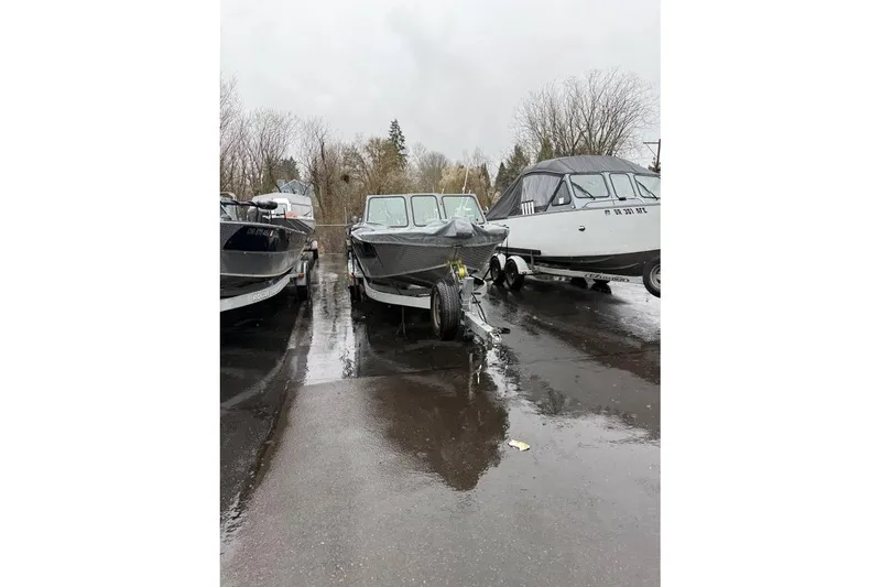 Slide: The Image of 2012 Alumaweld Super Vee Pro 23 boat parked on wet pavement. - 7