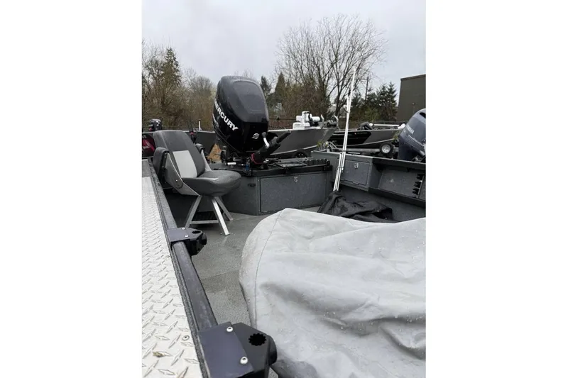 Slide: The Image of 2012 Alumaweld Super Vee Pro 23 boat interior with Mercury outboard motor. - 8