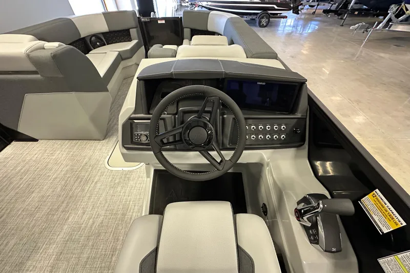 Slide: The Image of 2026 Alera M25L boat interior with modern steering and control panel. - 14