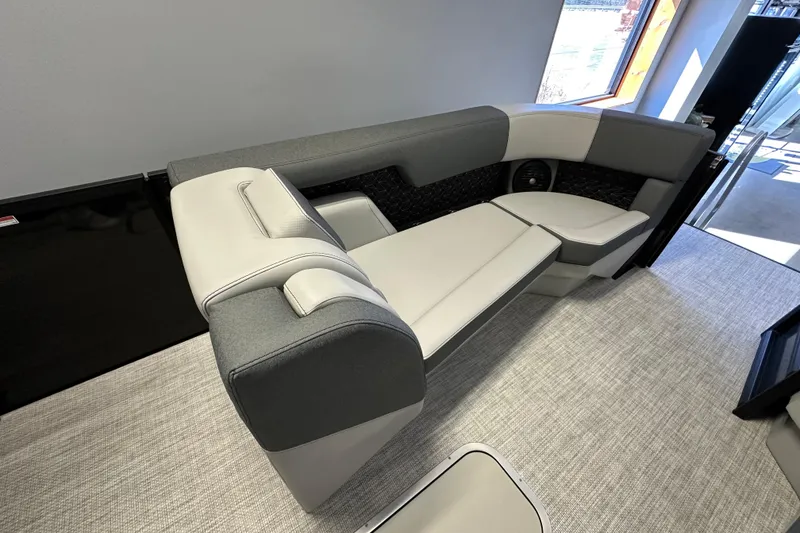 Slide: The Image of Modern Alera M25L 2026 boat interior with sleek gray and white seating. - 8