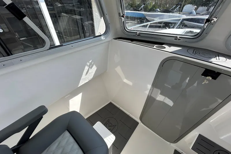 Slide: The Image of Interior of 2026 May-Craft 245 Pilot House, featuring sleek design and modern finishes. - 12