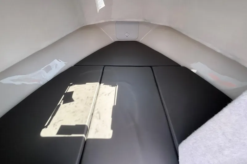 Slide: The Image of Interior cabin of 2026 May-Craft 245 Pilot House with cushioned seating. - 13