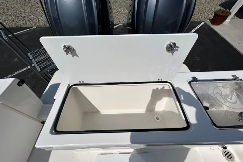 Slide: The Image of Open storage compartment on 2026 May-Craft 245 Pilot House boat. - 20