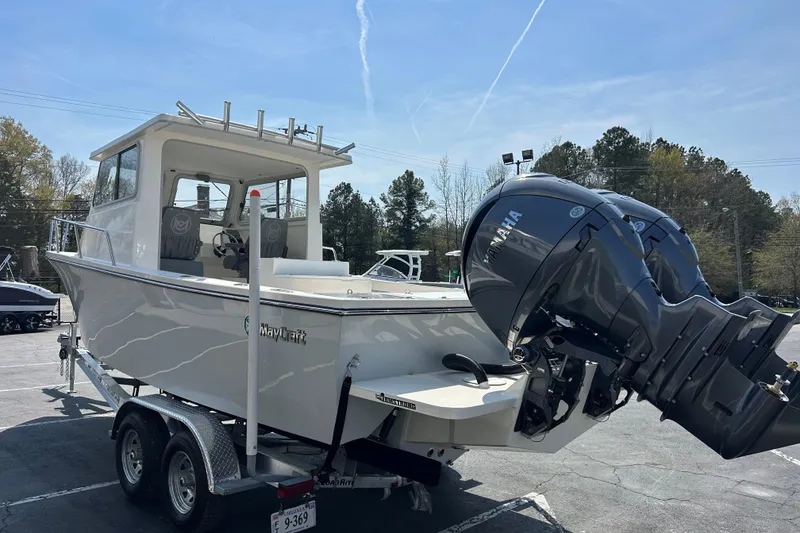 Slide: The Image of 2026 May-Craft 245 Pilot House boat with Yamaha engines on a trailer. - 5