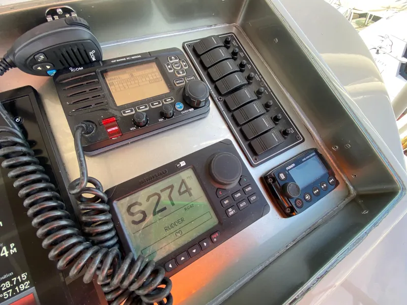 Slide: The Image of Control panel of a 1995 Mares 58 Power Cat with navigation and communication equipment. - 11