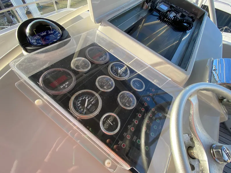 Slide: The Image of Control panel of 1995 Mares 58 Power Cat with gauges and compass. - 12