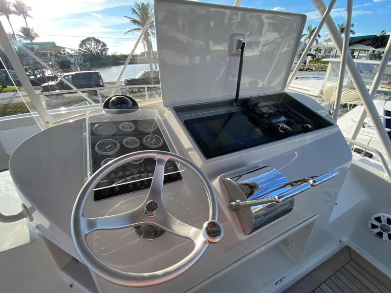 Slide: The Image of Helm of 1995 Mares 58 Power Cat with steering wheel and control panel. - 13