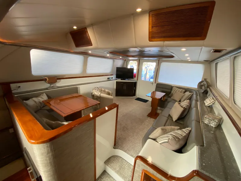 Slide: The Image of Luxurious interior of 1995 Mares 58 Power Cat with modern seating and entertainment area. - 34