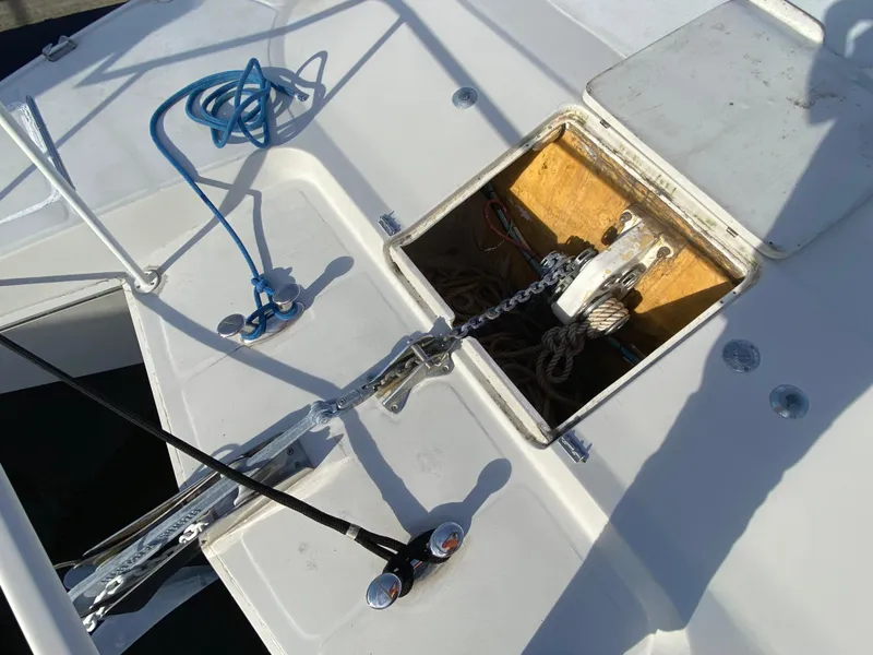 Slide: The Image of Anchor compartment of 1995 Mares 58 Power Cat with blue rope and chain. - 5