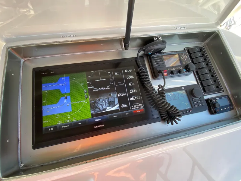 Slide: The Image of Navigation equipment on a 1995 Mares 58 Power Cat boat dashboard. - 9
