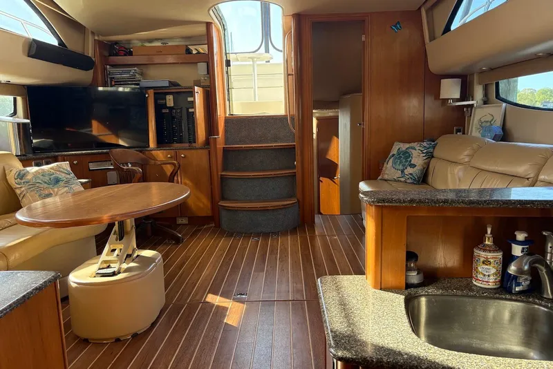 Slide: The Image of Luxurious 2004 Meridian 459 Motoryacht interior with elegant wood finishes and modern amenities. - 14