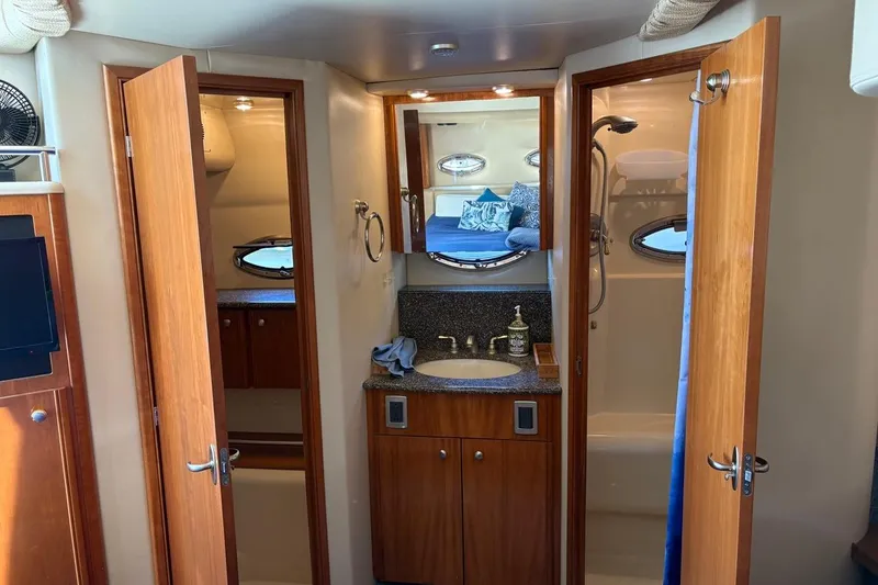 Slide: The Image of Interior of 2004 Meridian 459 Motoryacht featuring bathroom and cabin with wooden finishes. - 19
